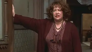Alicia Morton as Annie standing with Victor Garber as Oliver Warbucks, Kathy Bates as Miss Hannigan, and her dog Sandy on the poster for Annie (1999).