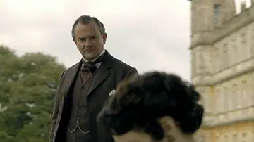Robert Crawley (Hugh Bonneville) approaches a man in the Downton Abbey Season 1 Episode 5 game