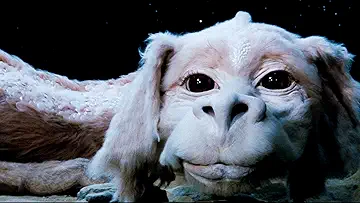 Falkor talking to Atreyu (Noah Hathaway) in The NeverEnding Story (1984).