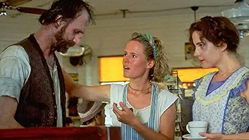 Kathy Bates' Evelyn Couch, Jessica Tandy's Ninny Threadgoode, Mary Stuart Masterson's Idgie Threadgoode, and Mary-Louise Parker's Ruth Jamison on the poster for the Fried Green Tomatoes game.