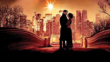 Colin Farrell and Jessica Brown Findlay embrace in a snowy scene from the Winter's Tale game.