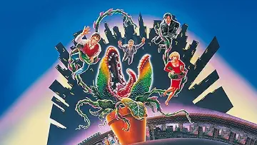 Audrey 2 (Levi Stubbs) prepares to eat Audrey (Ellen Greene) in Little Shop of Horrors (1986).
