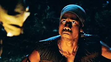 Tom Cruise as Les Grossman, yelling at the Flaming Dragon gang in Tropic Thunder (2008).