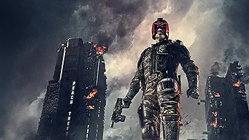 Karl Urban as Judge Dredd prepares to neutralize a threat in Alex Garland's Dredd (2012).