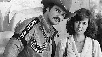 Bandit (Burt Reynolds), Carrie (Sally Field), and Buford T. Justice (Jackie Gleason) on the movie poster for Smokey and the Bandit II (1980) the Smokey and the Bandit II game