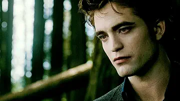 Bella Swan (Kristen Stewart) standing in a forest with Edward Cullen (Robert Pattinson) and Jacob Black (Taylor Lautner) in The Twilight Saga: New Moon game