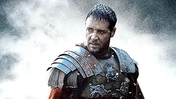 Maximus (Russell Crowe) stands dramatically in the Gladiator game!