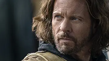 An orc yells at Arondir (Ismael Cruz Cordova) in The Lord of the Rings: The Rings of Power Season 1 Episode 3, 'Adar'.