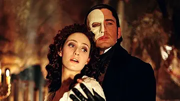 Gerard Butler as the Phantom embraces Emmy Rossum's Christine Daaé in Andrew Lloyd Webber's The Phantom of the Opera (2004).