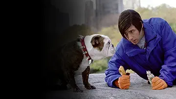 Adam Sandler's Nicky sits with a dog on a bench in Central Park on the poster for the Little Nicky game.