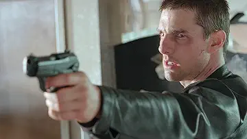 Tom Cruise as John Anderton fighting for his life in the Minority Report game.