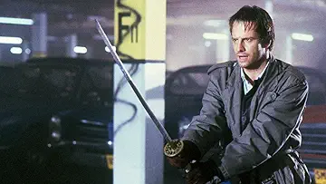 MacLeod (Christopher Lambert) and Heather (Roxanne Hart) meet Ramirez (Sean Connery) in Highlander (1986).