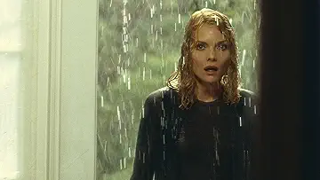 Claire Spencer (Michelle Pfeiffer) shows up to her front door drenched from a rain storm, in the What Lies Beneath game