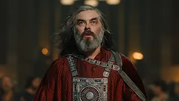 Arondir (Ismael Cruz Córdova) defends Isildur (Maxim Baldry) and Estrid (Nia Towle) from robbers in The Lord of the Rings: The Rings of Power Season 2 Episode 3, 'The Eagle and the Sceptre'.
