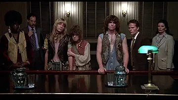 Treat Wililams' George Berger sits in front of his dancing friends on the poster for the Hair game