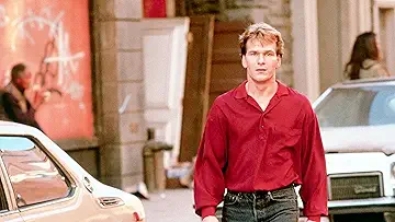 Patrick Swayze and Demi Moore embrace in the iconic Ghost movie trivia game.