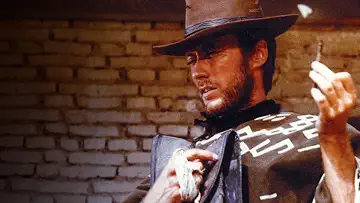 Clint Eastwood's Man with No Name prepares to get into a gun fight in A Fistful Of Dollars game
