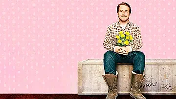 Ryan Gosling's Lars Lindstrom sits on his future blow-up doll on the poster for the Lars and the Real Girl game