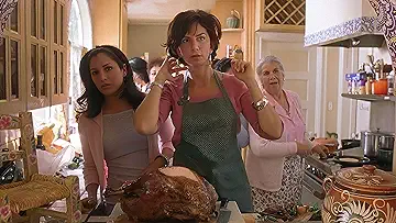 Four diverse families gathered around their Thanksgiving tables in the What's Cooking game.